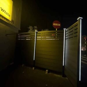 led integrated fence posts ipe slatted wpc fence corner and gate area at night
