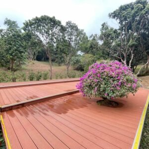 long straight park walkway built with grooved wpc decking boards in two tone colors