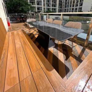 outdoor office break area composite decking two color plank layout teak coffee