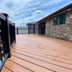 teak color co extrusion wpc deck with wide boards clean gaps and residential railing detail